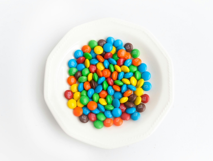 A white bowl of M&M candies